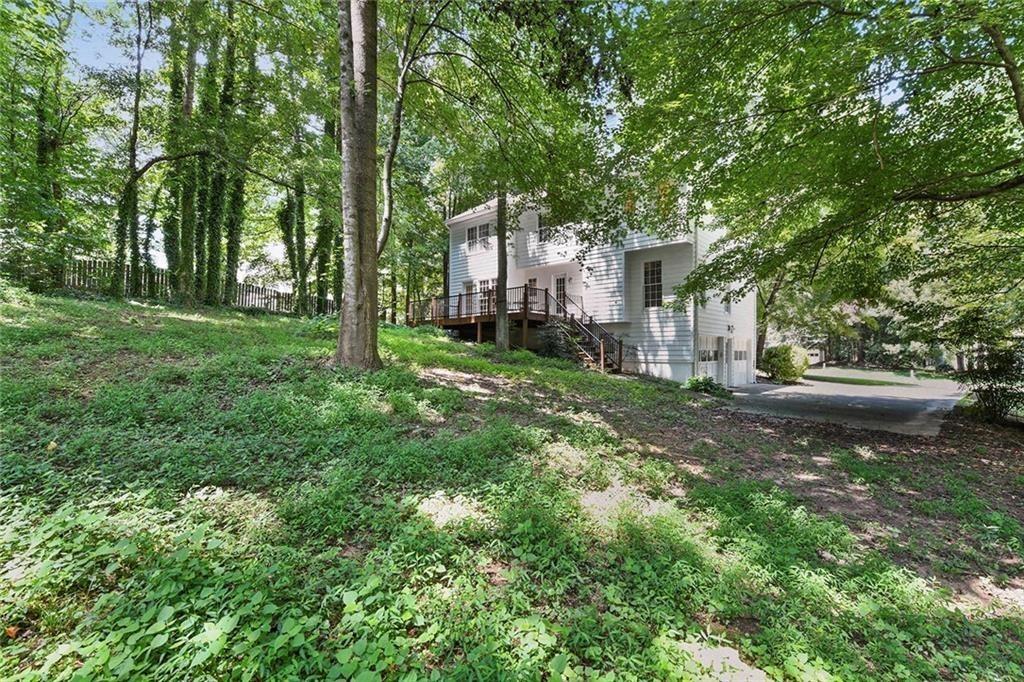 4235 Doubletree Court Cumming, GA 30040 - Photo 24 of 24 a view of a yard with plants and trees