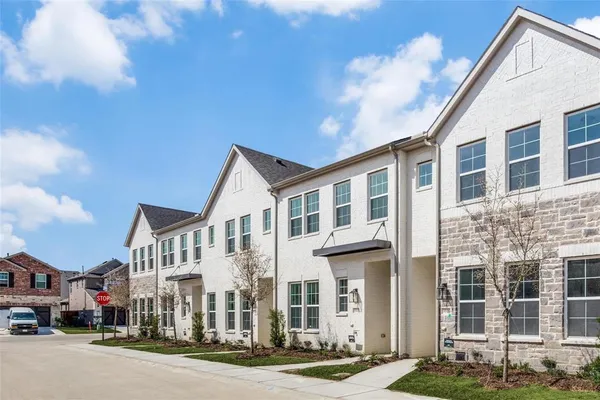 a city street lined with buildings and a street