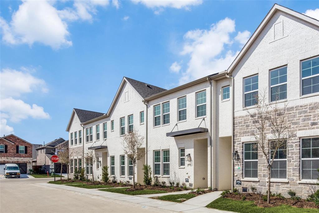 9915 Schramm Street Irving, TX 75063 - Photo 1 of 12 a city street lined with buildings and a street