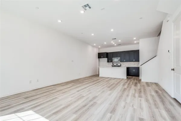 a view of a kitchen with a sink and a microwave
