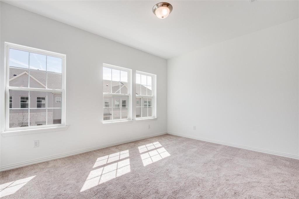 9915 Schramm Street Irving, TX 75063 - Photo 7 of 12 an empty room with a window