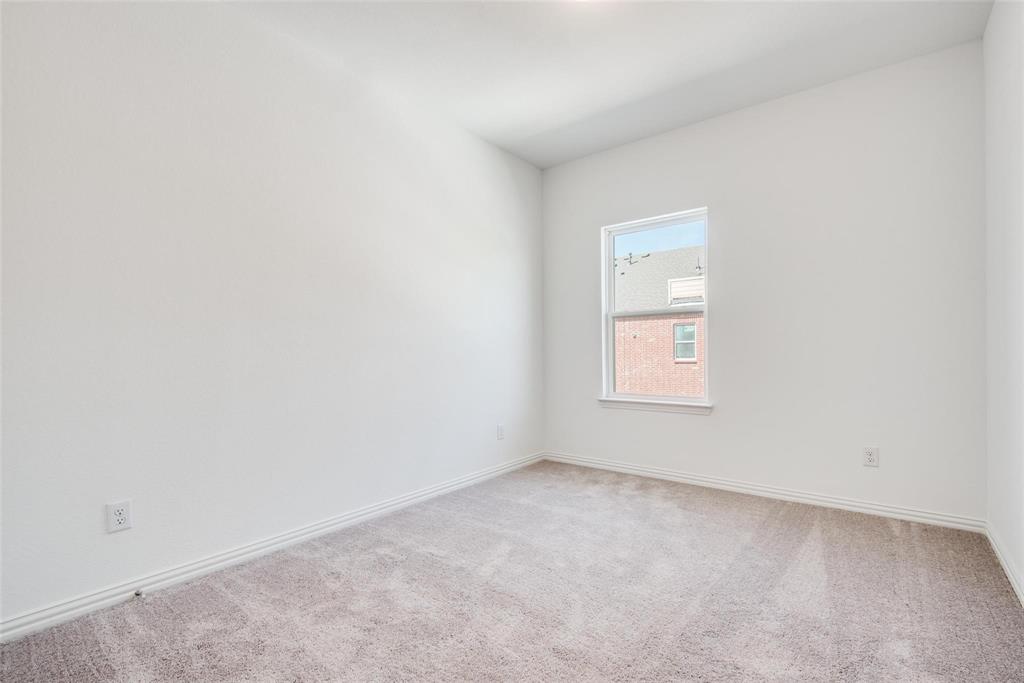 9915 Schramm Street Irving, TX 75063 - Photo 9 of 12 an empty room with a window