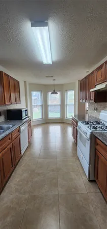 a white bath tub sitting next to a toilet