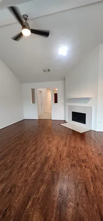 an empty room with a empty space and windows