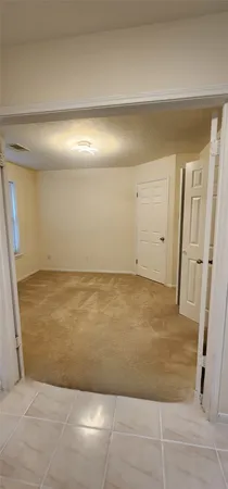 a kitchen with stainless steel appliances granite countertop a refrigerator a stove and a sink