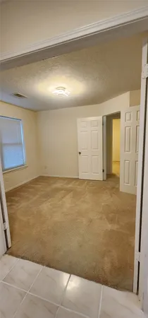 a large kitchen with kitchen island granite countertop a stove a sink dishwasher and a oven with wooden cabinets