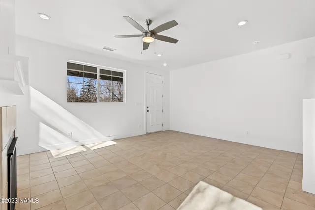 a kitchen with stainless steel appliances granite countertop a sink and a wooden floor