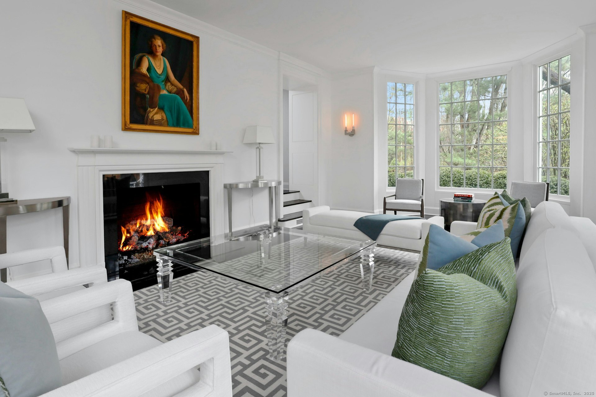 75 Hanson Road Darien, CT 06820 - Photo 5 of 30 a living room with furniture a fireplace and a large window