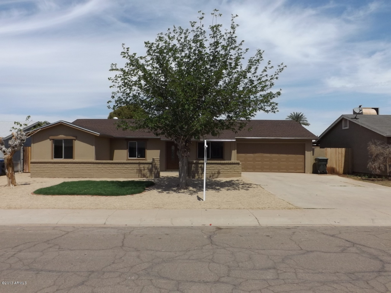6520 West Berkeley Road Phoenix, AZ 85035 - Photo 1 of 22 a house with yard in front of it