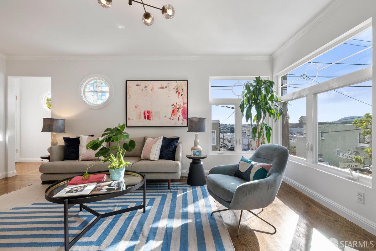 a living room with furniture and a table