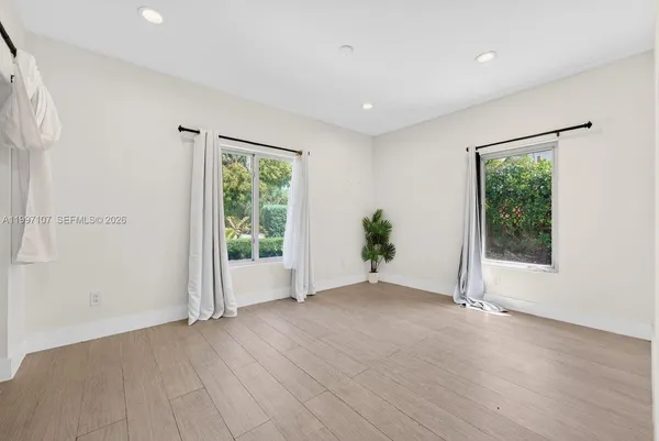 a view of an empty room with a window