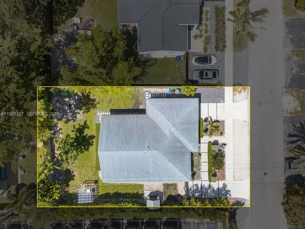 an aerial view of a house with outdoor space