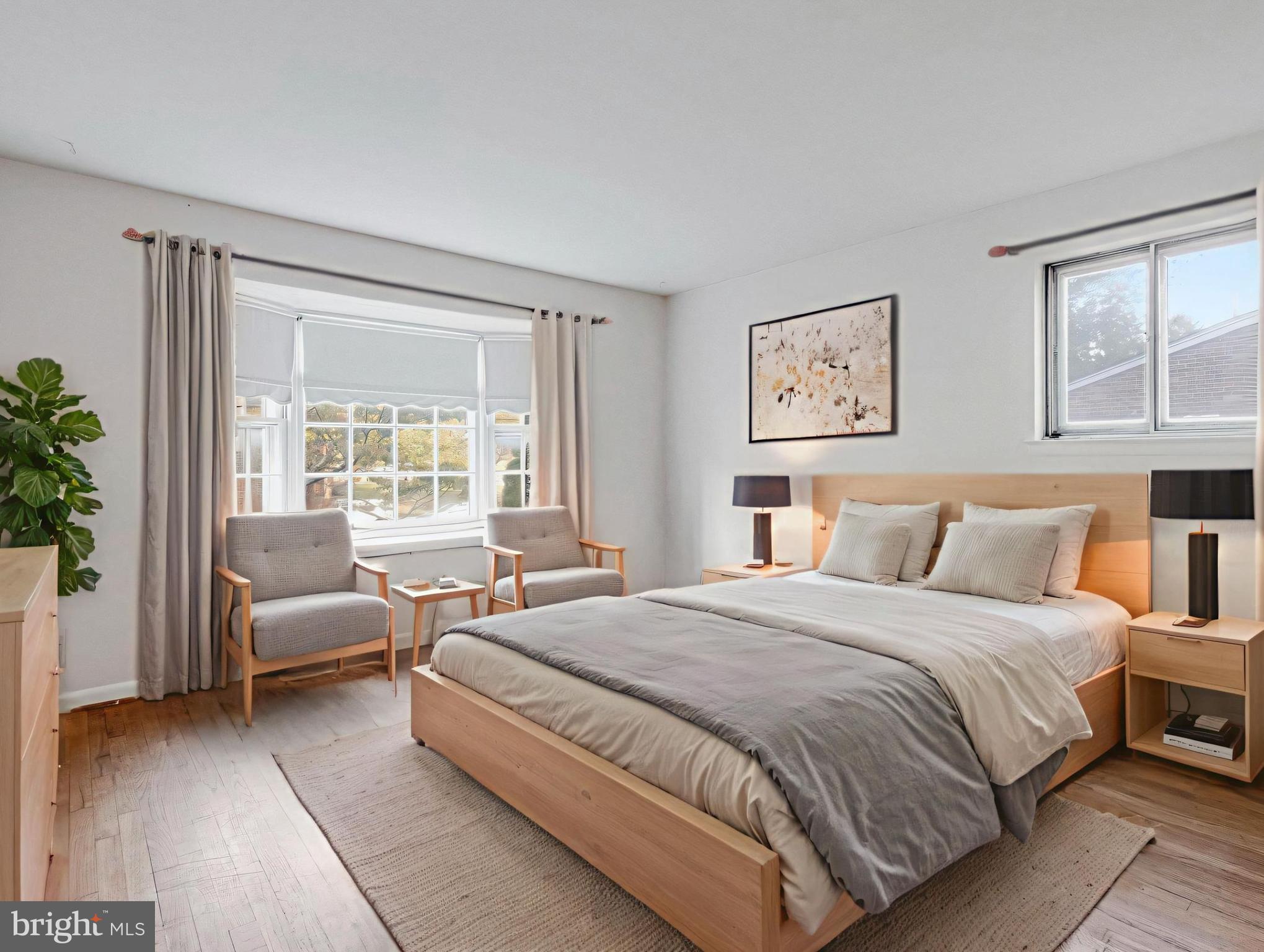 702 Lamberton Drive Silver Spring, MD 20902 - Photo 5 of 17 a bedroom with a bed and a couch with window