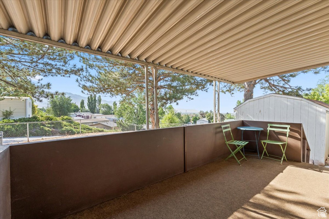 2875 North Hill Field Road, Unit 17 Layton, UT 84041 - Photo 18 of 23 Patio / terrace featuring a mountain view