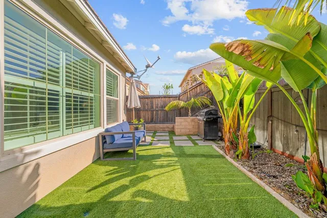 a view of a two chairs in the patio