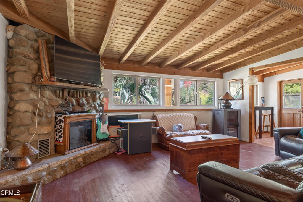 8416 Wheeler Canyon Road Santa Paula, CA 93060 - Photo 11 of 48 a living room with furniture and a fireplace