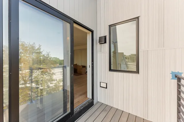 a view of a glass door and a window