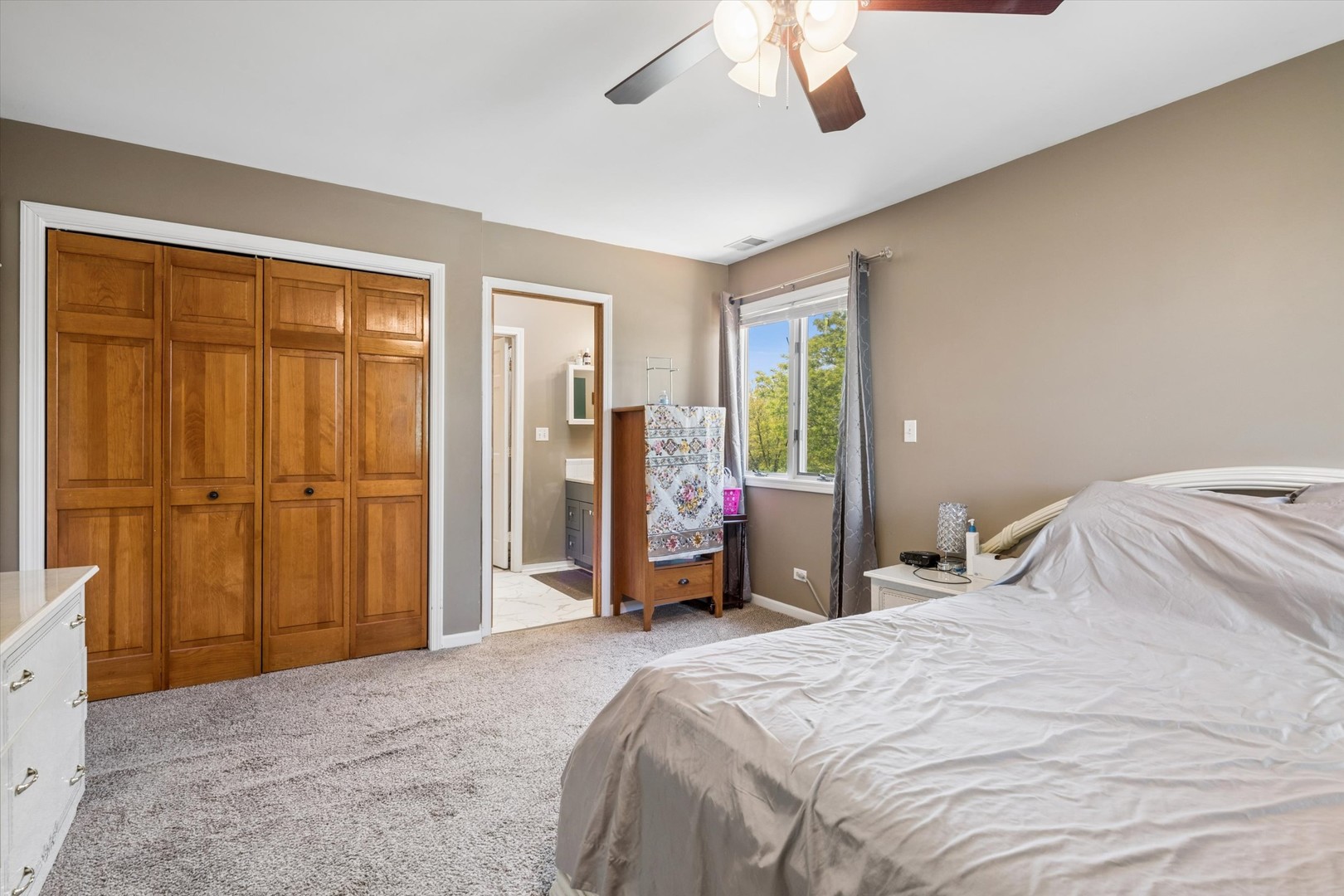 2142 North Summit Street Wheaton, IL 60187 - Photo 17 of 35 a bedroom with a bed dresser and a large window