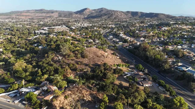 an aerial view of residential house and car parked