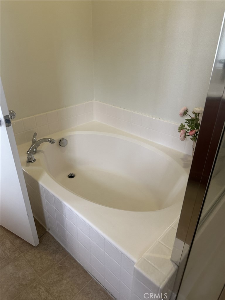 10375 Church Rancho Cucamonga, CA 91730 - Photo 16 of 22 a white bath tub sitting in a bathroom
