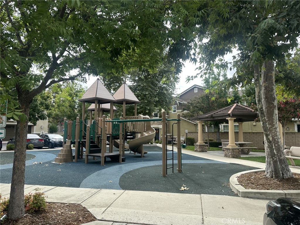 10375 Church Rancho Cucamonga, CA 91730 - Photo 17 of 22 a patio table and chairs with potted plants and large trees