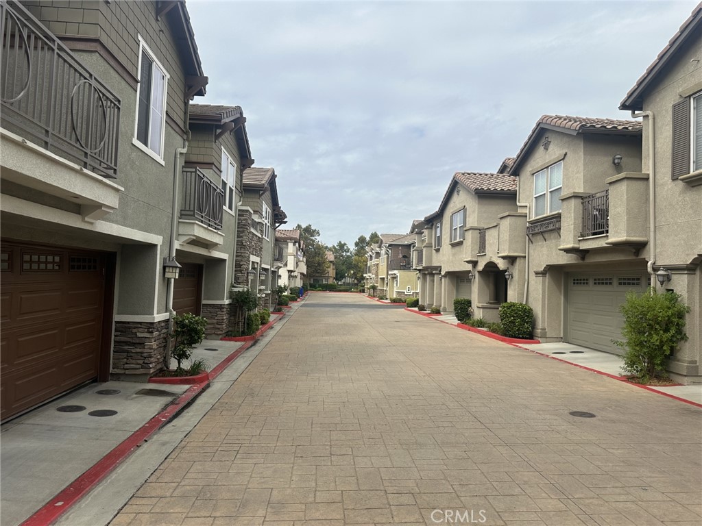 10375 Church Rancho Cucamonga, CA 91730 - Photo 20 of 22 a city street lined with tall buildings
