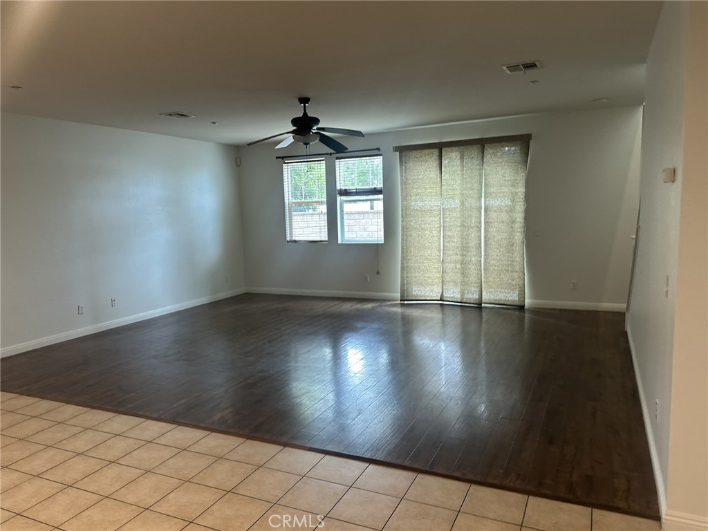 10375 Church Rancho Cucamonga, CA 91730 - Photo 5 of 22 an empty room with wooden floor and windows