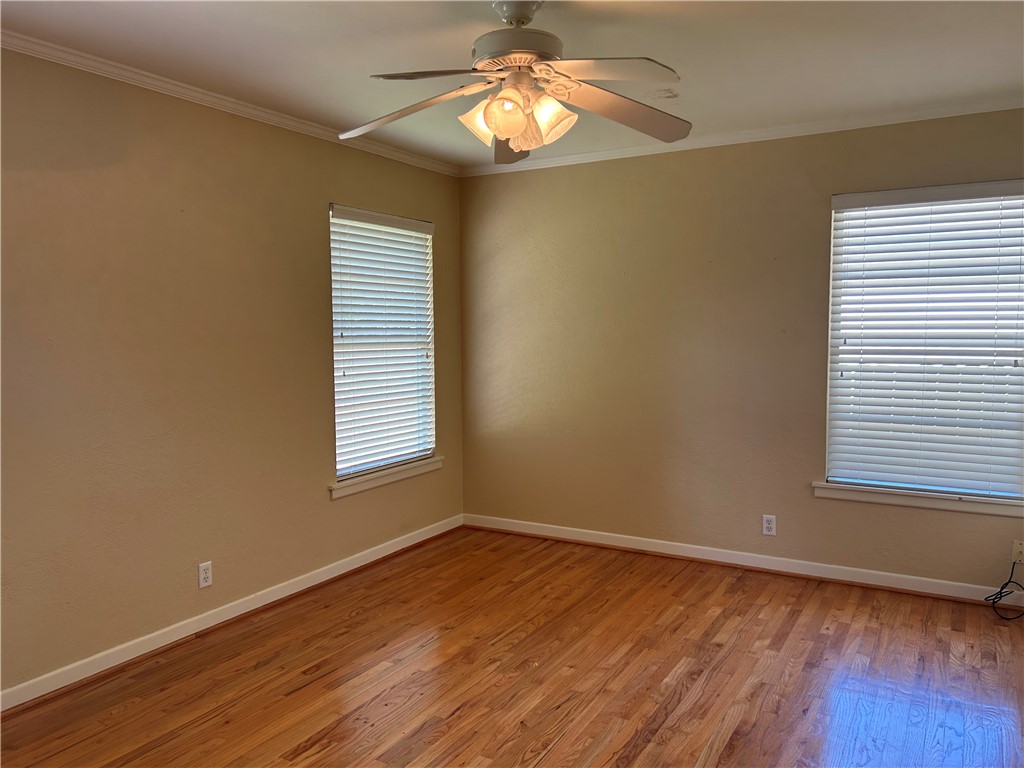 626 Bermuda Place Corpus Christi, TX 78411 - Photo 14 of 22 a view of empty room with wooden floor and fan