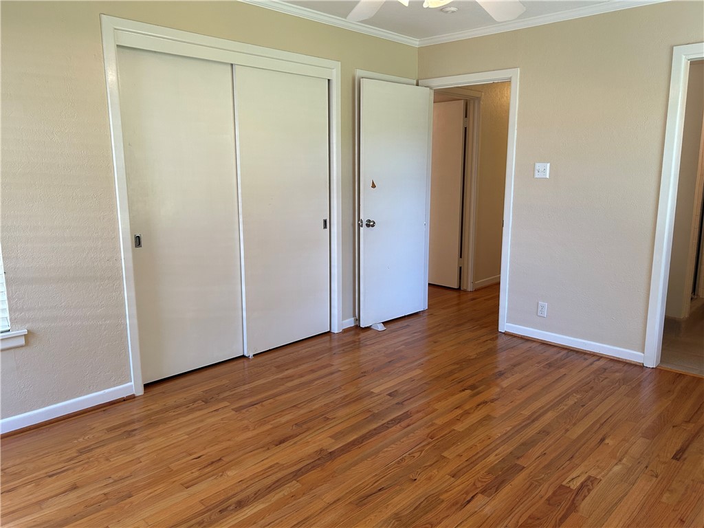 626 Bermuda Place Corpus Christi, TX 78411 - Photo 18 of 22 a view of an empty room with wooden floor