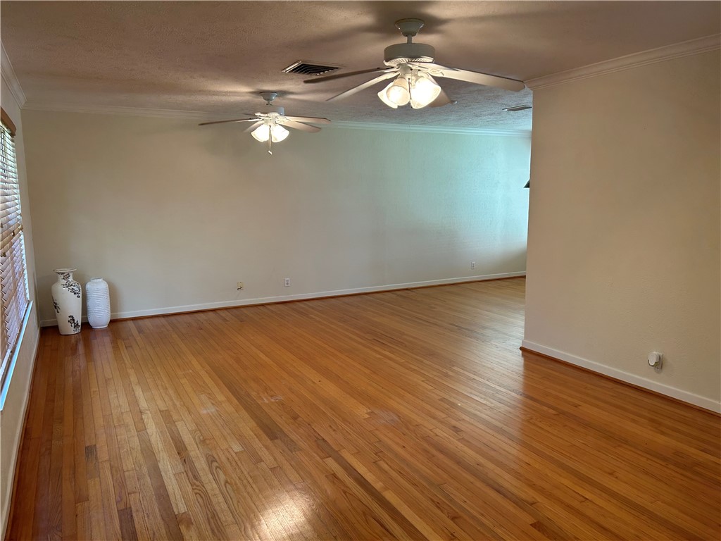 626 Bermuda Place Corpus Christi, TX 78411 - Photo 2 of 22 a view of empty room with wooden floor