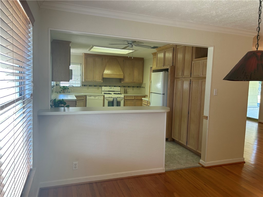 626 Bermuda Place Corpus Christi, TX 78411 - Photo 5 of 22 a view of kitchen with stainless steel appliances wooden floor and window