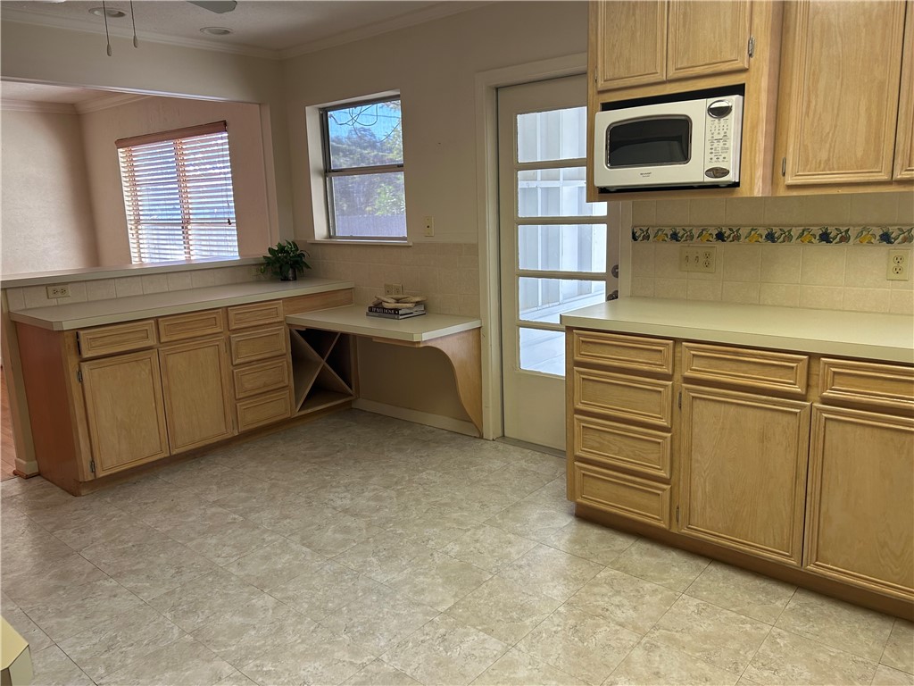 626 Bermuda Place Corpus Christi, TX 78411 - Photo 6 of 22 a kitchen with cabinets and window