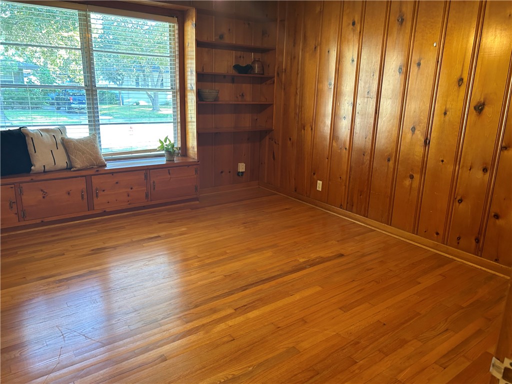 626 Bermuda Place Corpus Christi, TX 78411 - Photo 9 of 22 a view of an empty room with wooden floor and a window