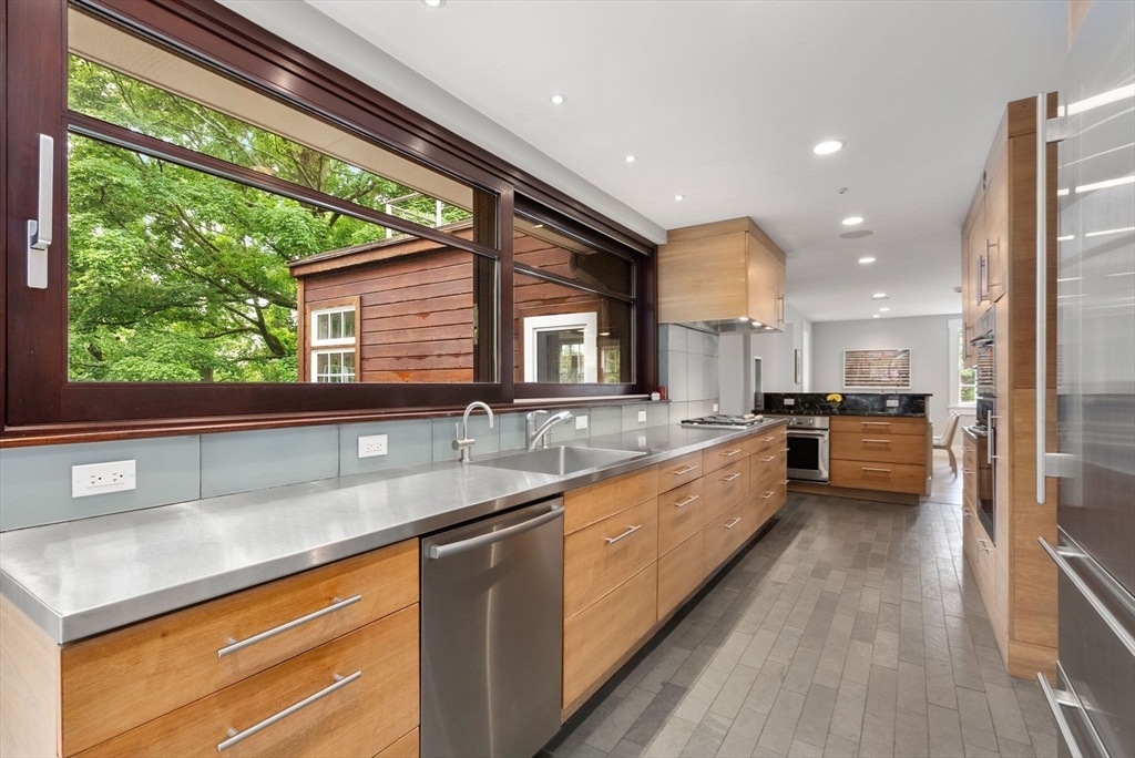 244 Heath Street Brookline, MA 02467 - Photo 14 of 36 a large kitchen with kitchen island a large window in it