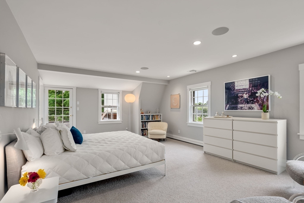 244 Heath Street Brookline, MA 02467 - Photo 16 of 36 a bedroom with a bed and wooden floor