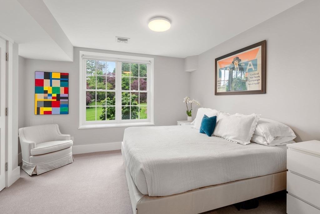 244 Heath Street Brookline, MA 02467 - Photo 26 of 36 a bedroom with a bed and a large window