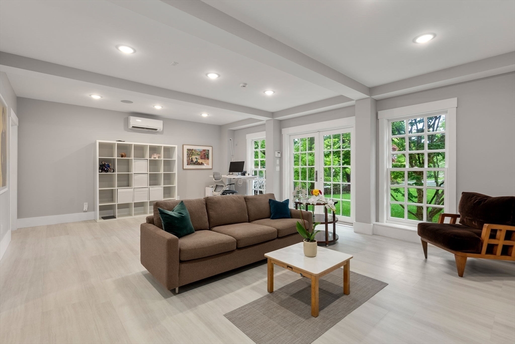 244 Heath Street Brookline, MA 02467 - Photo 28 of 36 a living room with furniture and a large window