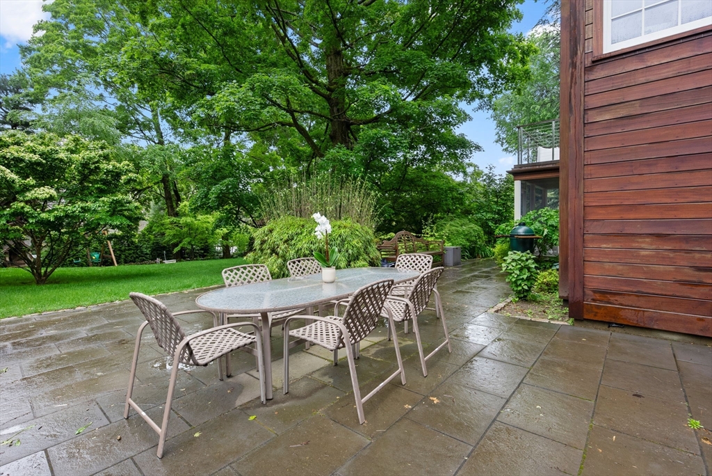 244 Heath Street Brookline, MA 02467 - Photo 30 of 36 a yard with table and a chairs