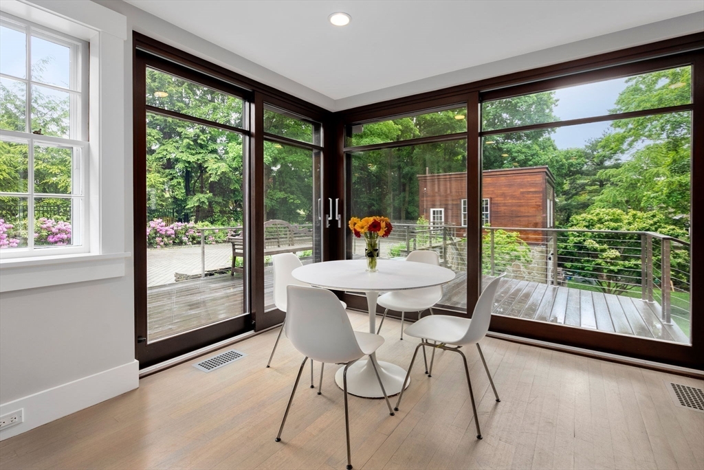244 Heath Street Brookline, MA 02467 - Photo 7 of 36 a dining room with furniture and garden view