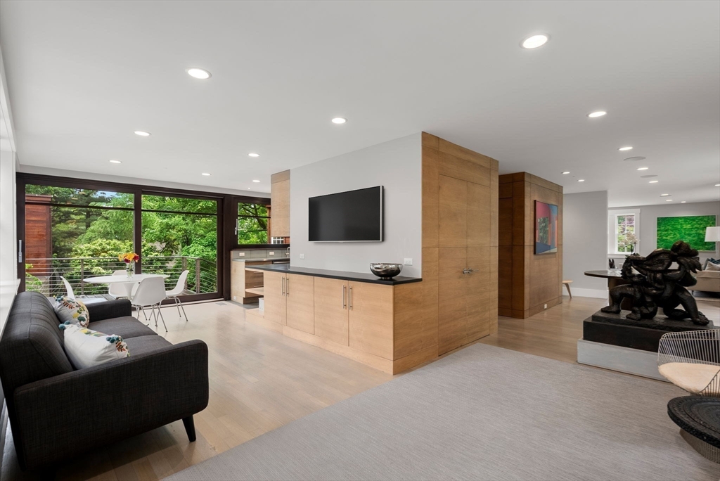 244 Heath Street Brookline, MA 02467 - Photo 8 of 36 a living room with furniture and a flat screen tv