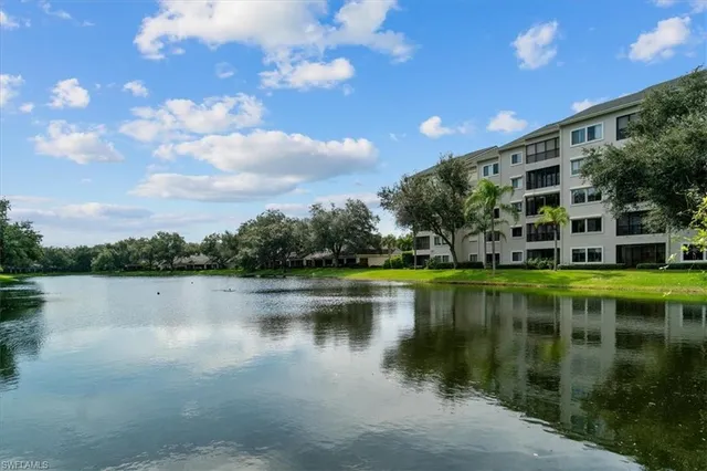 a view of a lake with a building in the background