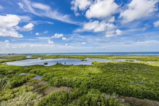 a view of a swimming pool and an outdoor seating