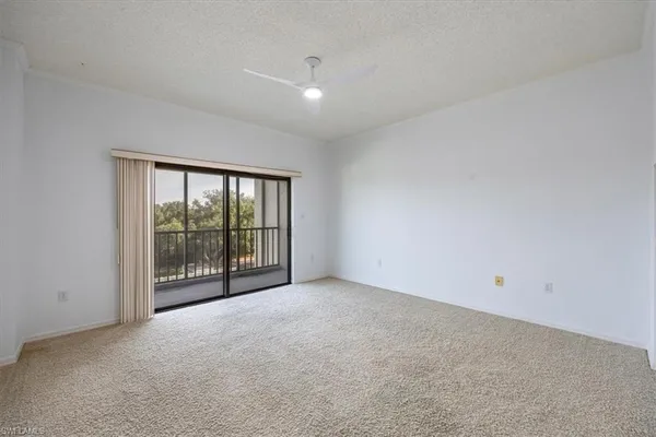 a view of an empty room with a sliding door