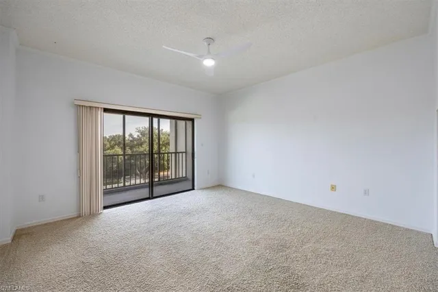 a view of an empty room with a sliding door