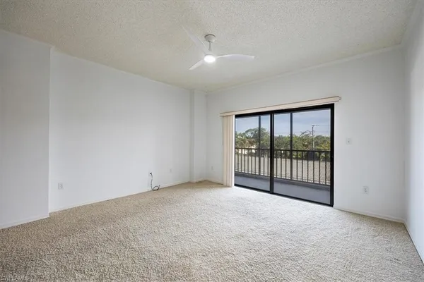 a view of an empty room with glass door