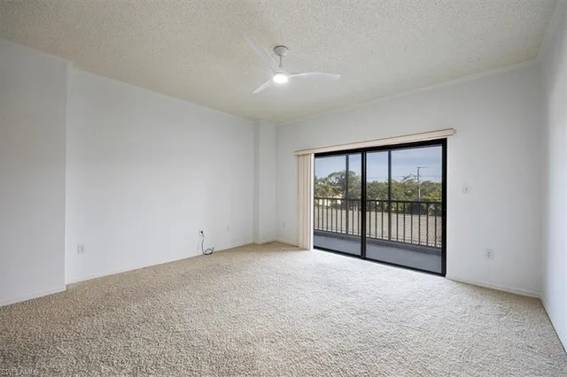 a view of an empty room with glass door