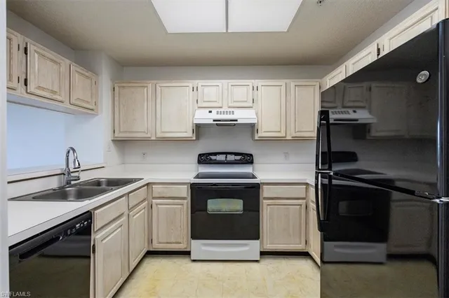 a kitchen with a stove and a sink