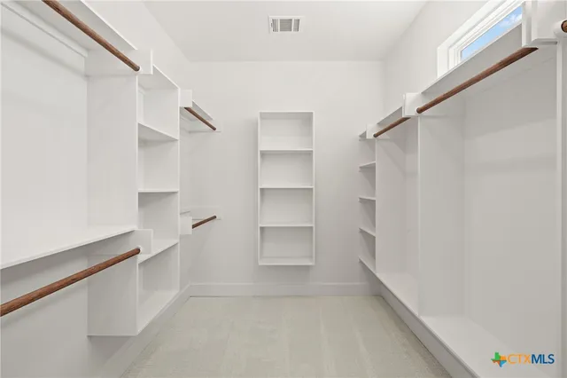 a view of an empty walk in closet