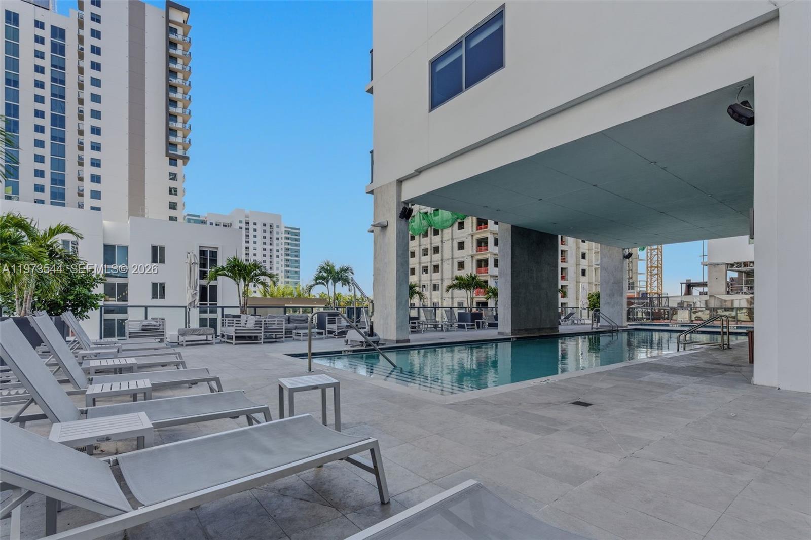 229 Southwest 9th Street, Unit 407 Miami, FL 33130 - Photo 5 of 29 a living room with furniture and a large window