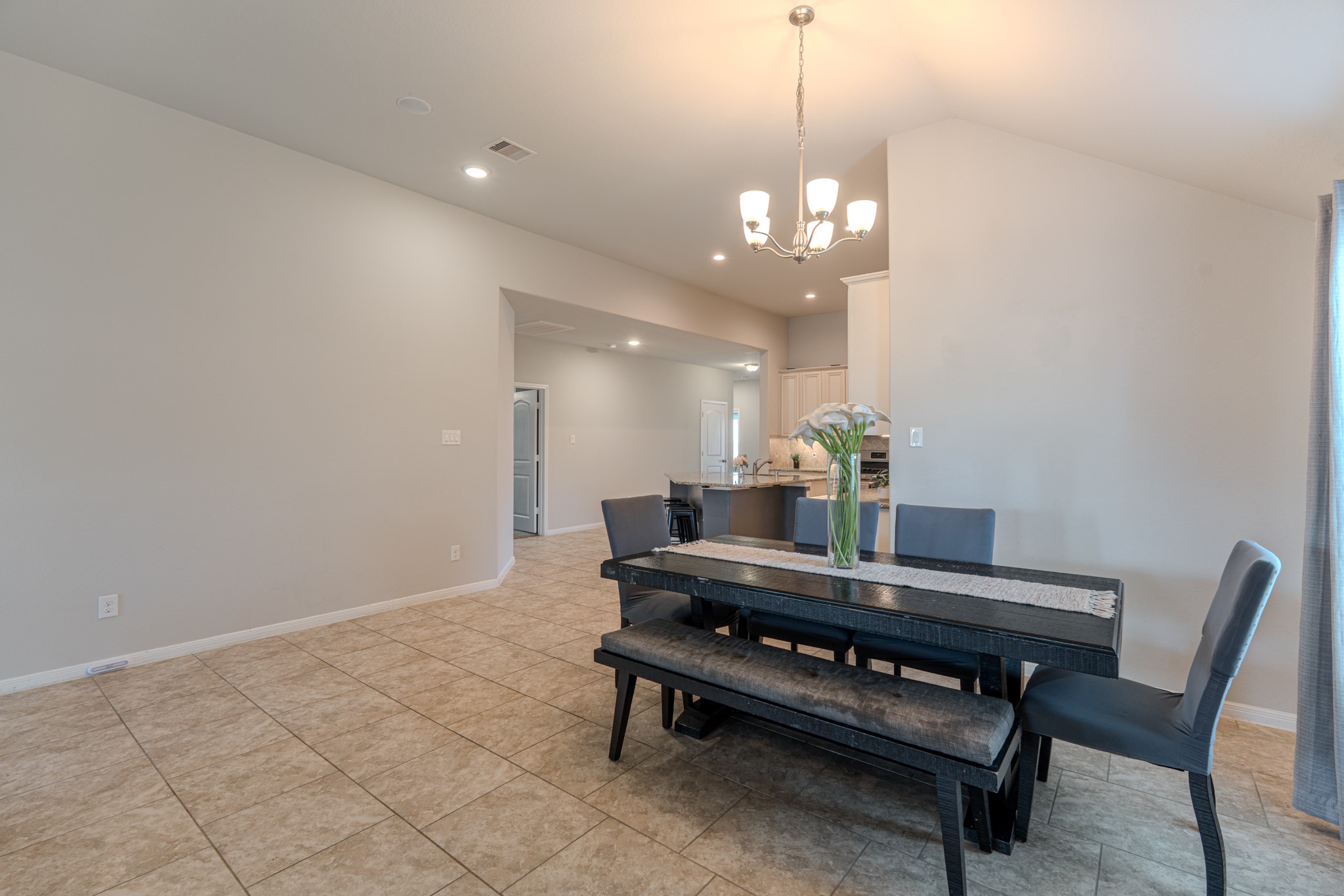 14207 Irvine Rnch Trail Conroe, TX 77384 - Photo 13 of 29 a living room with furniture and a chandelier